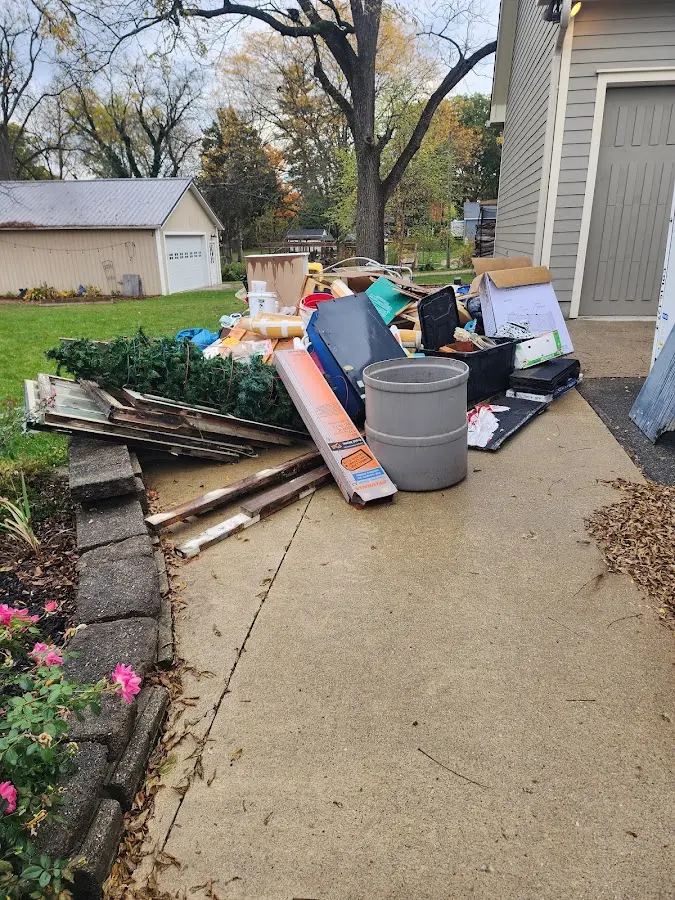 Dumpster being loaded with debris for Commercial Dumpster Rental in Helemano